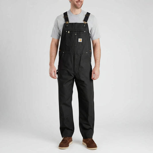 Person wearing black overalls on a white background