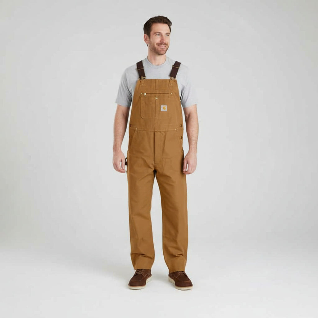 Person wearing brown overalls on a white background