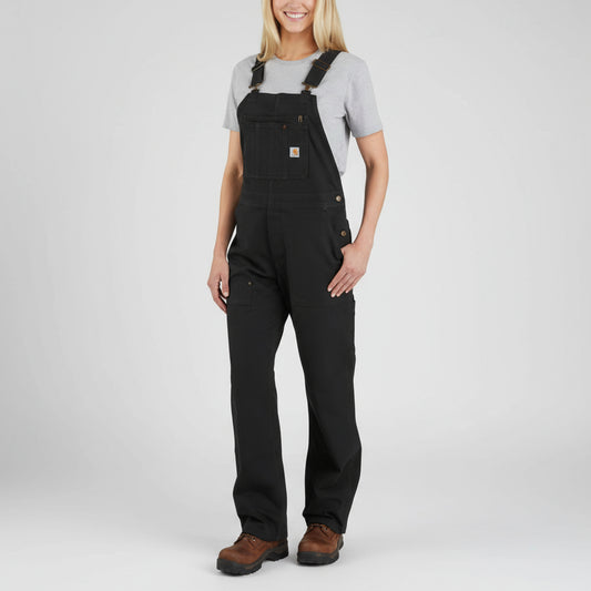 Person wearing black overalls on a white background