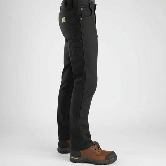 Person wearing black pants and brown boots on a white background