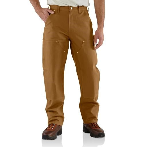 Brown work pants worn by a person on a white background