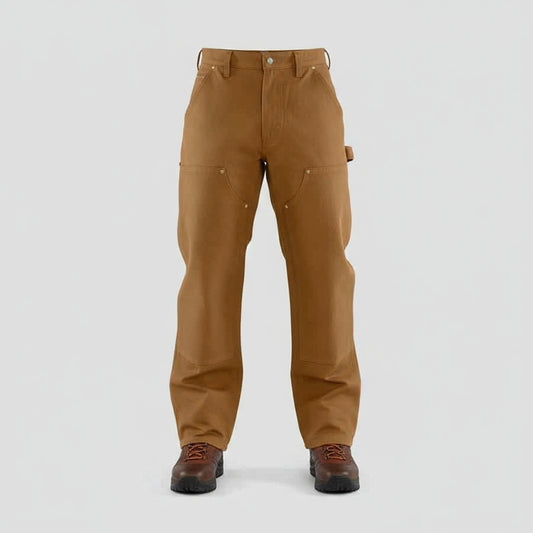 Brown work pants worn by a person on a white background