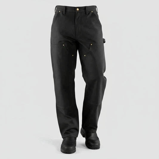 Person wearing black pants on a white background