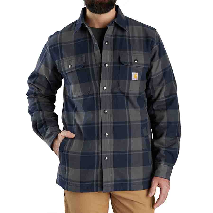 Man wearing a plaid shirt with a visible brand logo on a white background
