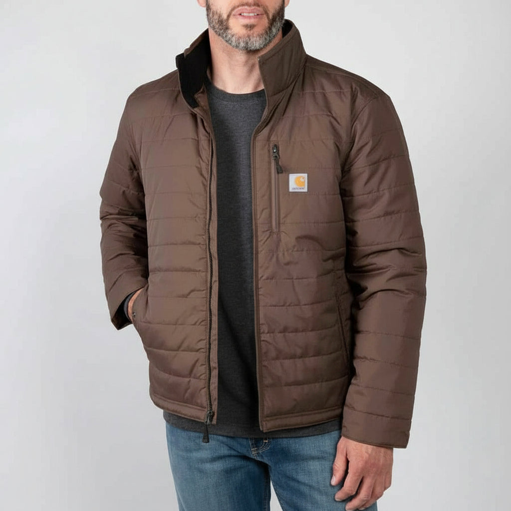Man wearing a brown quilted jacket with a visible brand logo on a white background