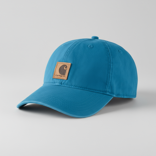 Blue cap with a brown leather patch on a white background