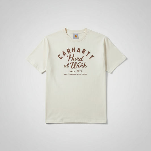 Person wearing a white t-shirt with Carhartt branding and text.