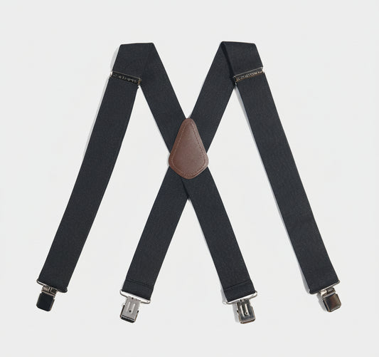 Black suspenders with a brown leather clip on a white background